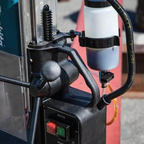 Makita HB350 magnetic drill, 1-3/8 in capacity, side view with coolant bottle.