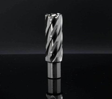 Annular cutter with spiral flutes, 15/16 in diameter, 2 in depth of cut, Weldon shank, upright on a reflective black surface