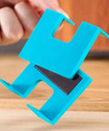 Close-up of blue Magnetic Hinge Jig for drill-free installation with 2mm alignment groove for cabinets and drawers woodworking projects.