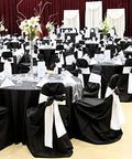 Elegant banquet hall with black covers and 10 Piece Satin Chair Sashes Bows For Wedding Reception And Banquet Decor Universal Back Tie For Chairs