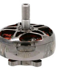 Close-up of a EMAX 2807 brushless motor featuring copper windings and a threaded shaft for RC FPV racing quads.