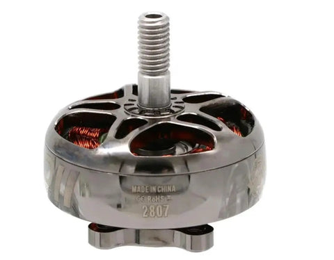 Close-up of a EMAX 2807 brushless motor featuring copper windings and a threaded shaft for RC FPV racing quads.