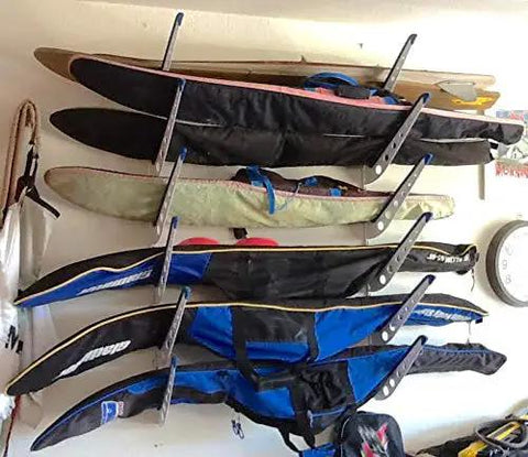 Heavy Duty Multi Level Water Ski Wall Rack Secures Four Pairs Of Skis Wakeboards And Wakesurfers With Scratch Free Padded Arms For Slick Garage Organization displaying multiple skis securely stored.