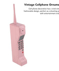 Kickass Vintage Cellphone Prop Cast From Heavy Duty Iron Serving Major Eighties Brick Phone Throwback Aesthetic view of pink vintage cell phone ornament.