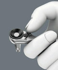 Close-up of Go-To 38 Piece Tool Set With Zyklop Mini One Quarter Inch Bit Mounting being held, grey background