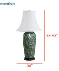 Green Glaze Floral Embossed Ceramic Table Lamp With Dark Wood Base, Traditional 33.5 Inch Height, Oval Bell Off White Linen Shade
