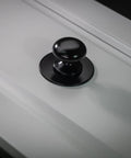 Matte Black Large Bifold Closet Door Knobs Four Pack With Renovation Ready Wide Base Zinc Round Kitchen Wardrobe Dresser Dummy Pull Knobs One And A Half Inch Furniture Sideboard Drawer Handles installed on door