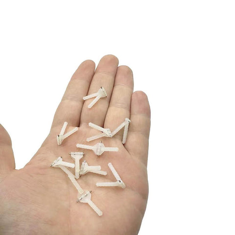 Hand holding 10 Pieces RC Airplane Plastic Needle Hinge Pins for RC Planes and Helicopters DIY Model Aircraft Wing Fixing Parts