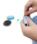 Hands using Colorful Needle Threaders Set Of 20 For Hand And Machine Sewing Tools For Crafting Knitting Quilting And DIY Art Ideal For Quick Threading