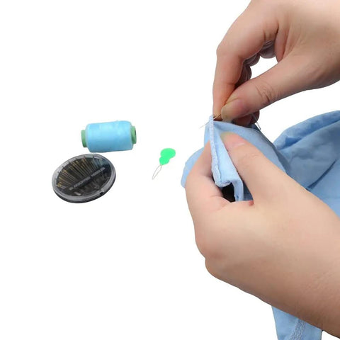 Hands using Colorful Needle Threaders Set Of 20 For Hand And Machine Sewing Tools For Crafting Knitting Quilting And DIY Art Ideal For Quick Threading