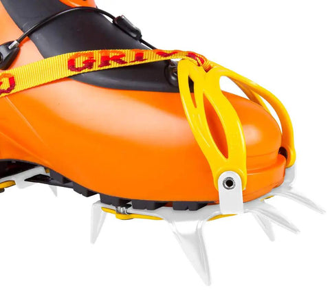 Ski Tour New-Matic Crampons For Ski Touring With Ultra Lightweight, Bomb Proof Front Bail attached to orange ski boot
