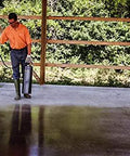 Man applying Tough As Nails Penetrating Concrete Sealer For Driveways And Retaining Walls Breathable Moisture Shield on a concrete slab.