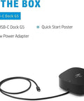 Image showing the HP USB-C Dock G5, 100W power adapter, and quick start poster included in the box.