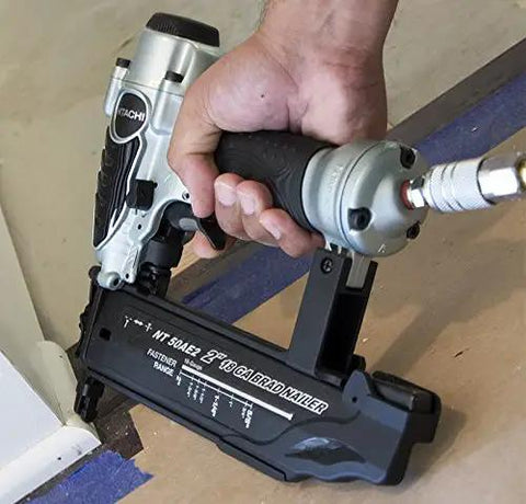 Lightweight 18 Gauge Brad Nailer With Hella Cushion Grip in hand, showcasing trigger and housing for precise trim work.