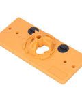 Hinge hole jig base, orange plastic, 35mm, top view with two black adjustment knobs