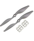 RC Airplane Propeller 7x5 Two Blade Nylon Gray 2 Pack With Adapter Rings CW Rotation Lightweight Durable 8mm Thick Fits 7mm Or 9mm Hub Easy Swap For Higher Output And Longer Life.