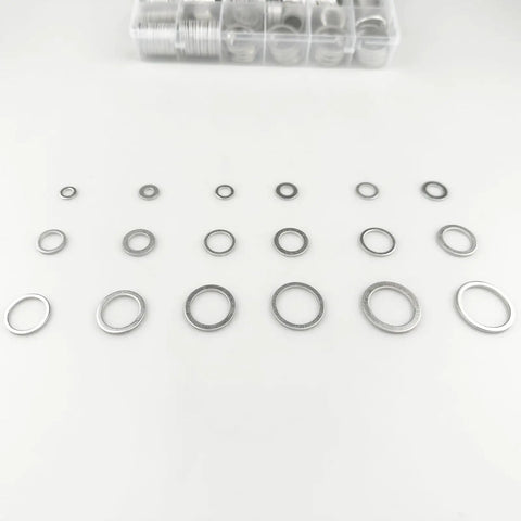 570 Piece Oil Drain Plug Gasket And Crush Washer Kit With 18 Sizes M6 Through M24 Aluminum Flat Washers in rows on a table