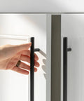 Hand reaching for Five Pack 10 Inch Matte Black Cabinet Handles For Kitchen Cabinets And Dresser Drawers, Stainless Steel Pulls