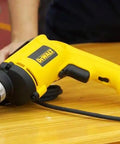 Drywall Screw Gun With 6.0 Amp Motor, Depth Sensitive Nosepiece, Two Finger Trigger, 5300 RPM on wooden table