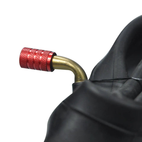 Close-up of valve stem with red cap on inner tube for 9x3.50-4 Tire With Inner Tube Replacement Pack For 49cc Stand Up Gas Scooters, Go Karts