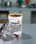 Nokorode 14020 Paste Flux For Plumbing, All Purpose Soft Solder Flux with lid and brush, 8 oz container in workshop.