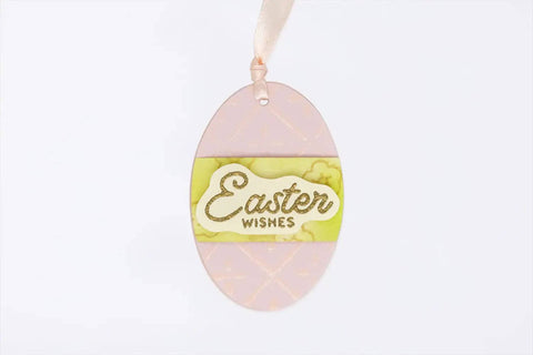 Pastel pink oval Easter egg card with 'Easter Wishes' label, created using 3 Inch Oval Easter Egg Lever Action Punch For Paper Crafting And Scrapbooking.