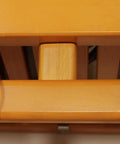 Close-up of heavy-duty metal hanging rod on Sweet Solid Wood Closet Organizer System With Slick Honey Maple Finish.