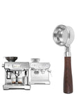 Pull That Perfect Shot With This 58mm Bottomless Portafilter Featuring Two Heavy Duty Filter Baskets And A Straight Up Comfy Wood Handle For Keeping Your Daily Brew Game Tight, showcasing polished steel and wooden handle.