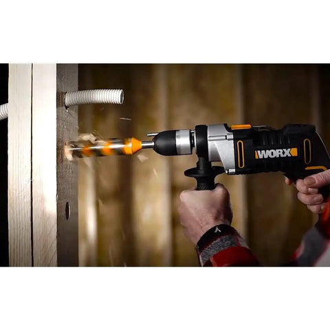 Knockout Impact Drill Packing 810 Watts And A Beefy 13 Mm Chuck Featuring Variable Speed Control drilling through wood.
