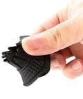 Tesla Cybertruck Wiper Hole Cover Pad Keeps Dang Leaves At Bay, held in hand, flexible black polymer, protects wiper components.