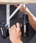 Using 20V Max Three-Eighths Inch Drill Driver With Power Share System on shelf bracket, compact and ergonomic design visible