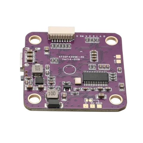 Close-up of AT32-based flight controller with OSD and 16MB recorder, showcasing circuit board for RC drones and model airplanes.