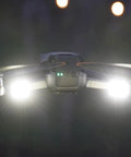 Arc V Pro Grade Multi Color Drone Strobe With Remote Control, 1000 Lumen Output, LEDs lit up on a flying drone at night.
