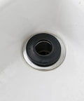 Close-up of 10pcs Pop up Bathtub Drain Stopper Gasket Rubber Washer Replacement installed in a bathtub drain.