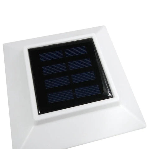 Top view of 18 Pack White Solar LED Post Cap Lights For Outdoor Posts And Decks showing solar panel on white square cap.