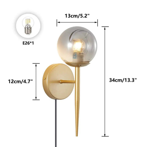 2 Light Plug In Globe Wall Sconce With Smoky Gray Glass Shade And Brass Finish Delivers A Cozy Vibe And Soft Glow For Bathroom