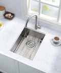 12 Inch Bar Sink Undermount For Small Kitchens And RVs 16 Gauge Stainless Steel Single Bowl Wet Bar Sink With Bottom Grid And Drain Assembly Compact Undermount Kitchen Sink For Outdoor Kitchens installed in a countertop with accessories