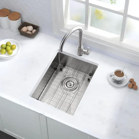 12 Inch Bar Sink Undermount For Small Kitchens And RVs 16 Gauge Stainless Steel Single Bowl Wet Bar Sink With Bottom Grid And Drain Assembly Compact Undermount Kitchen Sink For Outdoor Kitchens installed in a countertop with accessories