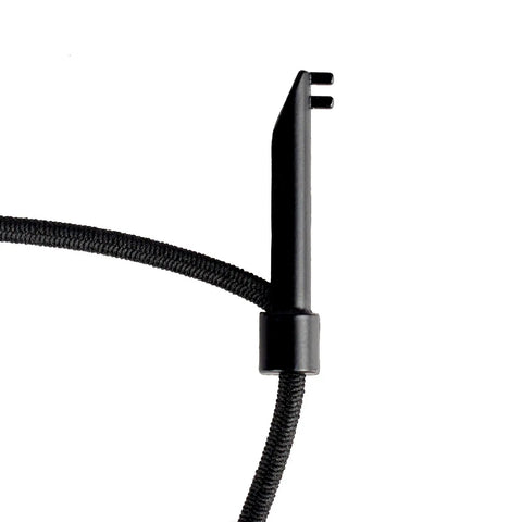 Close-up of Escape Bracelet With Handcuff Key And Car Window Breaker, elastic band and metal component in black.