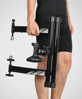 Person holding an Indoor Bike Trainer With Magnetic Resistance Foldable Portable Turbo Trainer Stand, showcasing foldable design.