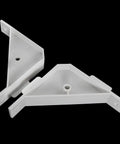 Dead Simple Twelve Piece Set Of Crisp White Plastic Ninety Degree Cabinet Triangle Brackets Knockout Corner Support Braces For Furniture And Quick Fixups, two pieces displayed.