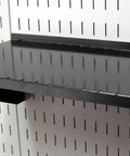 9 Inch Deep Pegboard Shelf Assembly For Slotted Pegboard Tool Boards Black Heavy Duty Wall Storage Solution mounted on wall