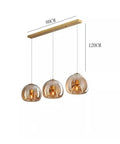 Modern Dine Dining Room Pendant Lights Indoor Lighting, 3-bulb ceiling lamp with amber glass shades, 80cm length, 120cm height.