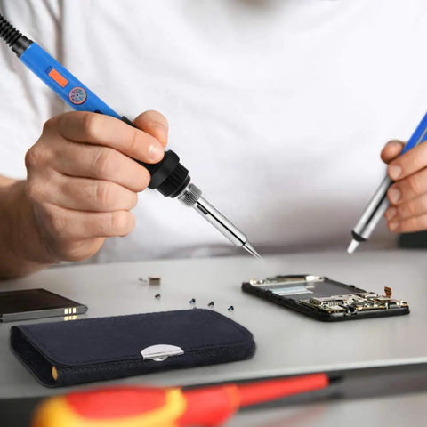 Person using 60W Soldering Iron Kit With Adjustable Temperature Jewelry Soldering Gun on electronics repair project