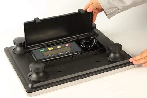Heavy Duty Digital Postal Scale With Adjustable Viewing Head And Fold Away Handle, black with LCD display and coil cord.
