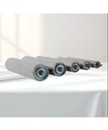 Top Tier Stainless Steel Conveyor Roller Idler for Heavy Duty Logistics Systems with varying diameters on a table.