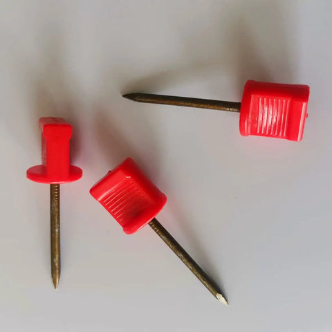Three red-headed nails from 20Pack Archery Target Pins Heavy Duty Manganese Steel Nails With Plastic Heads For Holding Target Faces And Paper