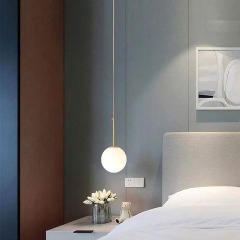 Bedroom setting with Plug In Globe Pendant Light With Frosted Glass Ball Shade, Easy To Install Ceiling Pendant For Dining Room, Bedroom Or Hallway, 17 Foot Cord, Soft Warm Glow For Cozy, Romantic Ambience And Modern Style, hanging beside bedside table.