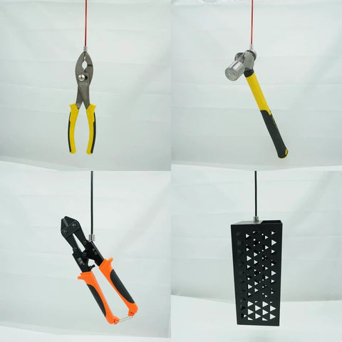 VASTOOLS magnetic pickup tool set, four-piece: yellow-handled pliers, hammer, orange cutter, and black perforated block.