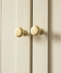2 Pack Brushed Gold Cabinet Knobs Set Vintage Retro Drawer Pulls installed on light-colored cupboard doors.